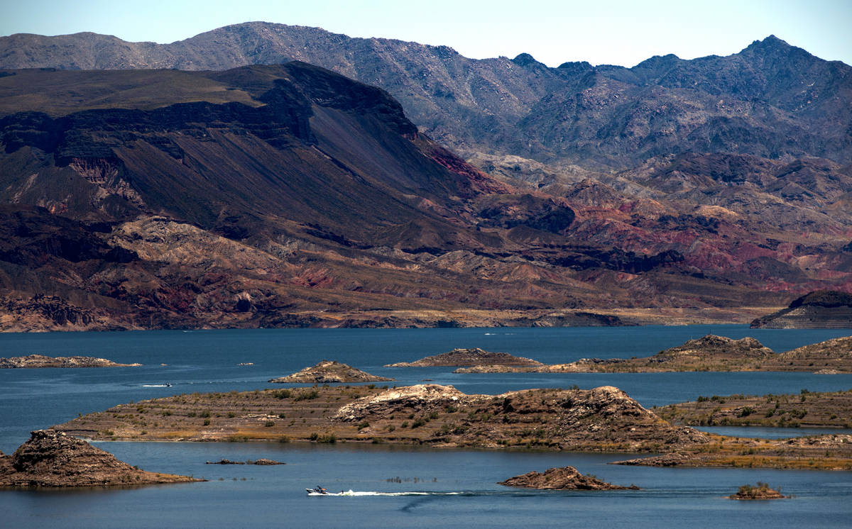 A boat pulls a water skier seen from the 33 Hole Scenic Overlook in the Lake Mead National Recr ...