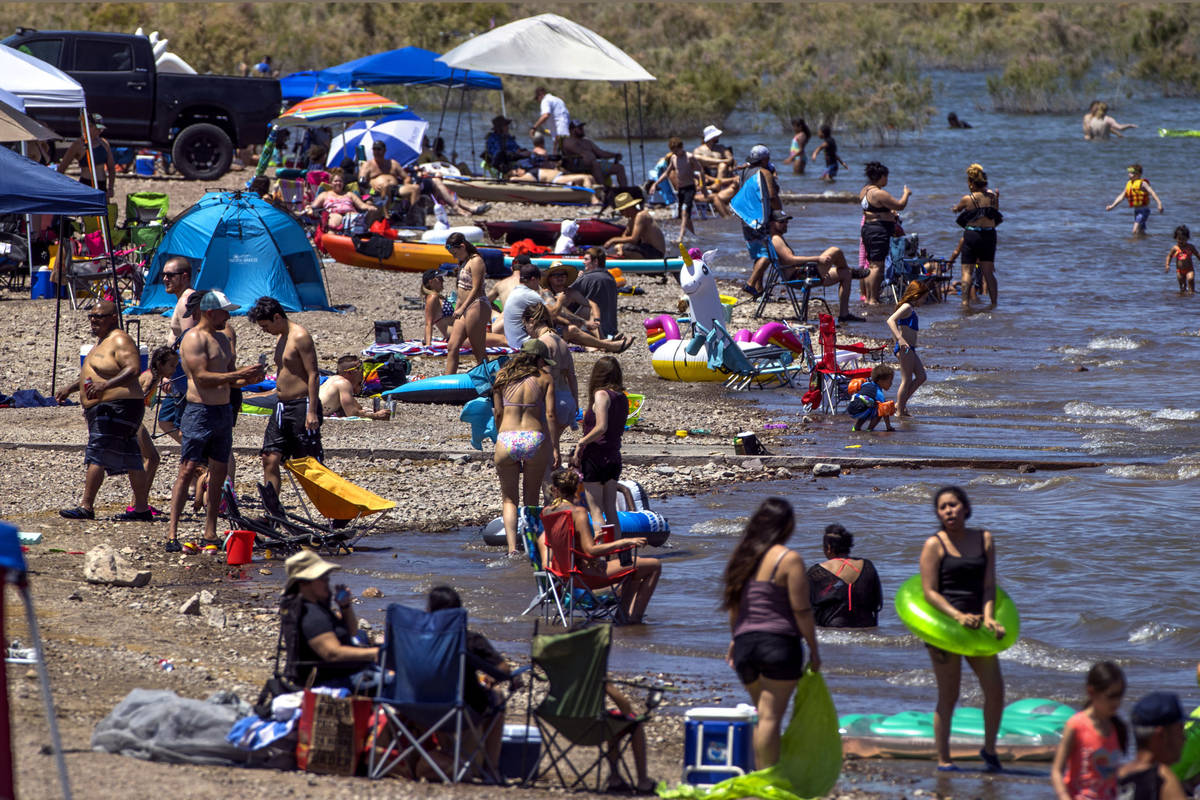 Visitors practice little social distancing at Boulder Beach in the Lake Mead National Recreatio ...