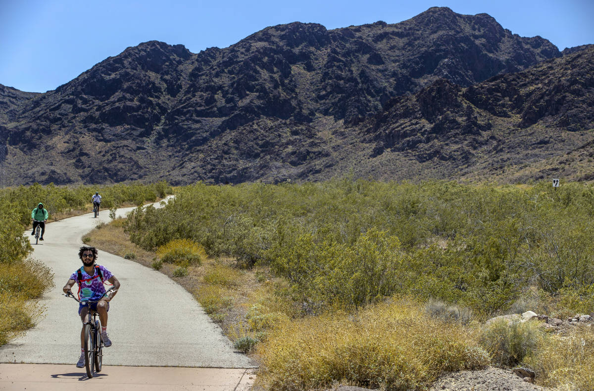 Cyclists move along a path in the Lake Mead National Recreation Area which is now open to annua ...