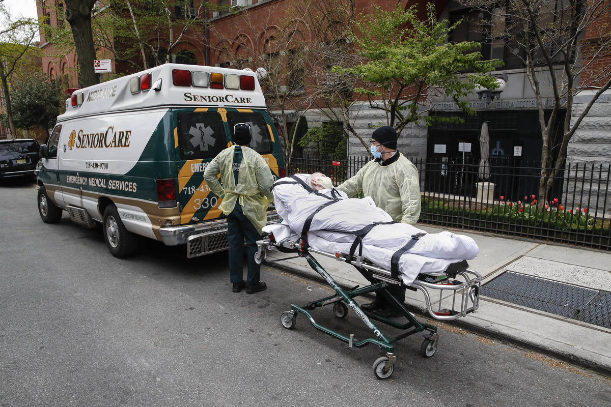 FILE- In this April 17, 2020 file photo, a patient is wheeled out of Cobble Hill Health Center ...