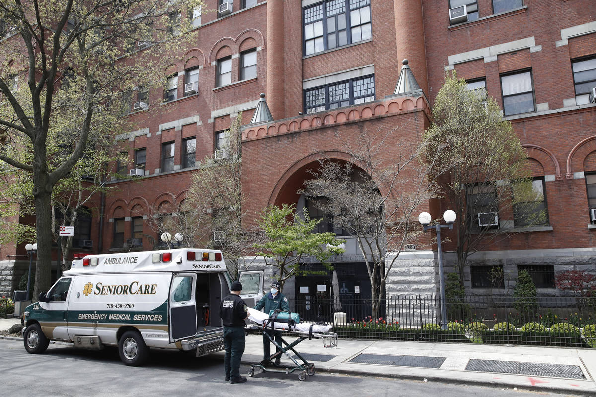 Emergency medical workers arrive at Cobble Hill Health Center, Friday, April 17, 2020, in the B ...