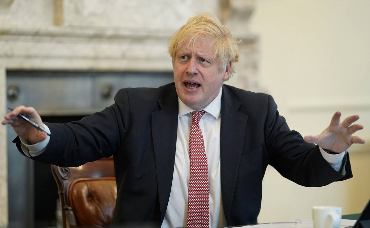 In this photo provided by 10 Downing Street, Britain's Prime Minister Boris Johnson chairs his ...