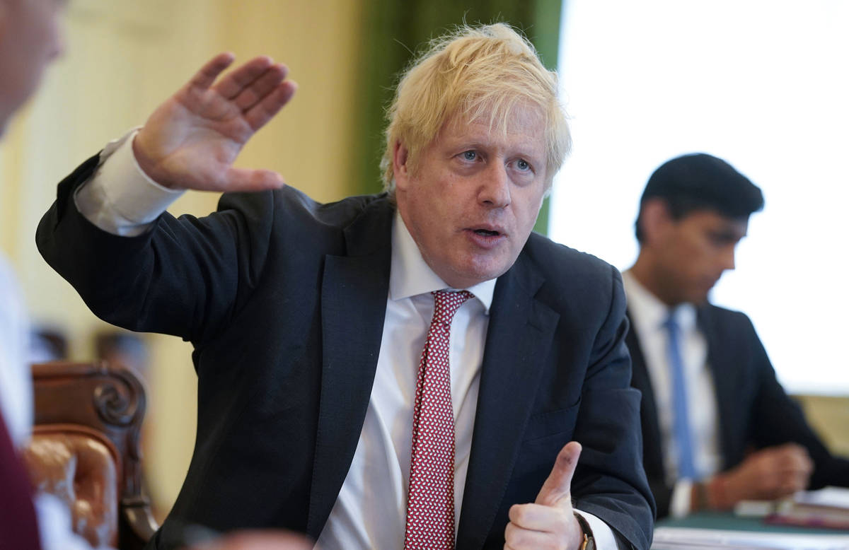In this photo provided by10 Downing Street, Britain's Prime Minister Boris Johnson chairs his f ...