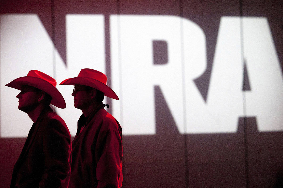 FILE - In this May 4, 2013, file photo, National Rifle Association members listen to speakers d ...