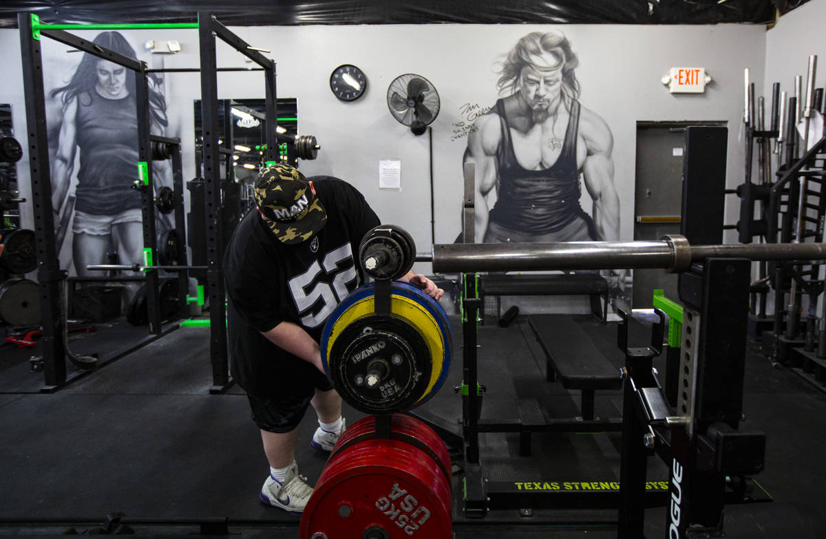 Paul Minor grabs weights at The Lift Factory in Las Vegas on Thursday, Feb. 27, 2020. (Chase St ...