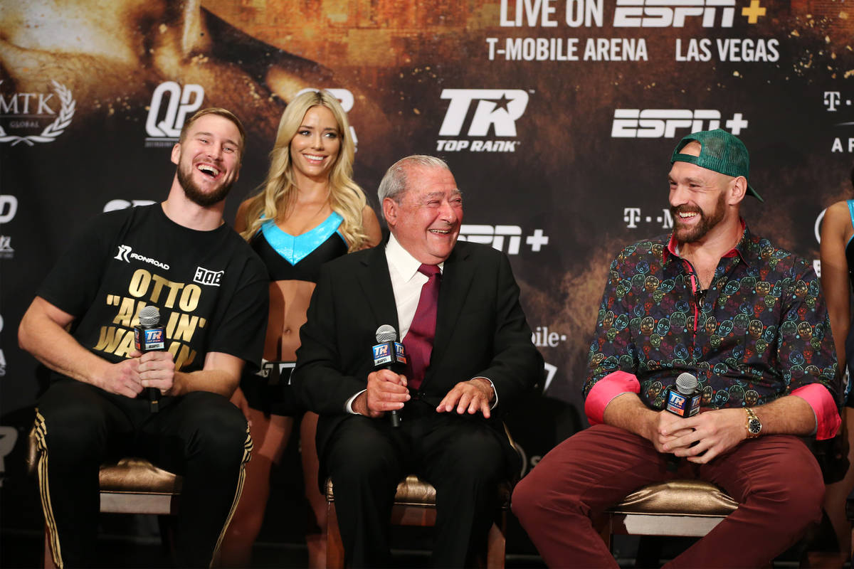 Otto Wallin, from left, boxing promoter Bob Arum and Tyson Fury, share a laugh during a press c ...