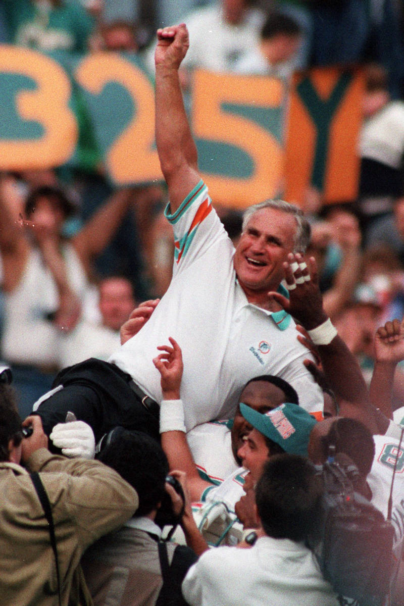 Miami Dolphins coach Don Shula is carried on his team's shoulders after his 325th victory, at P ...