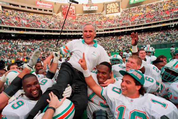 Miami Dolphins coach Don Shula is carried on his team's shoulders after his 325th victory, agai ...