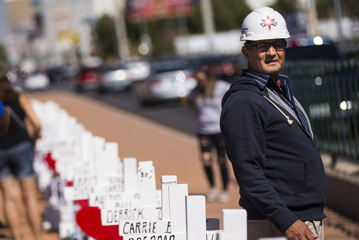 Greg Zanis stands by the 58 crosses he placed near the "Welcome to Fabulous Las Vegas&quot ...