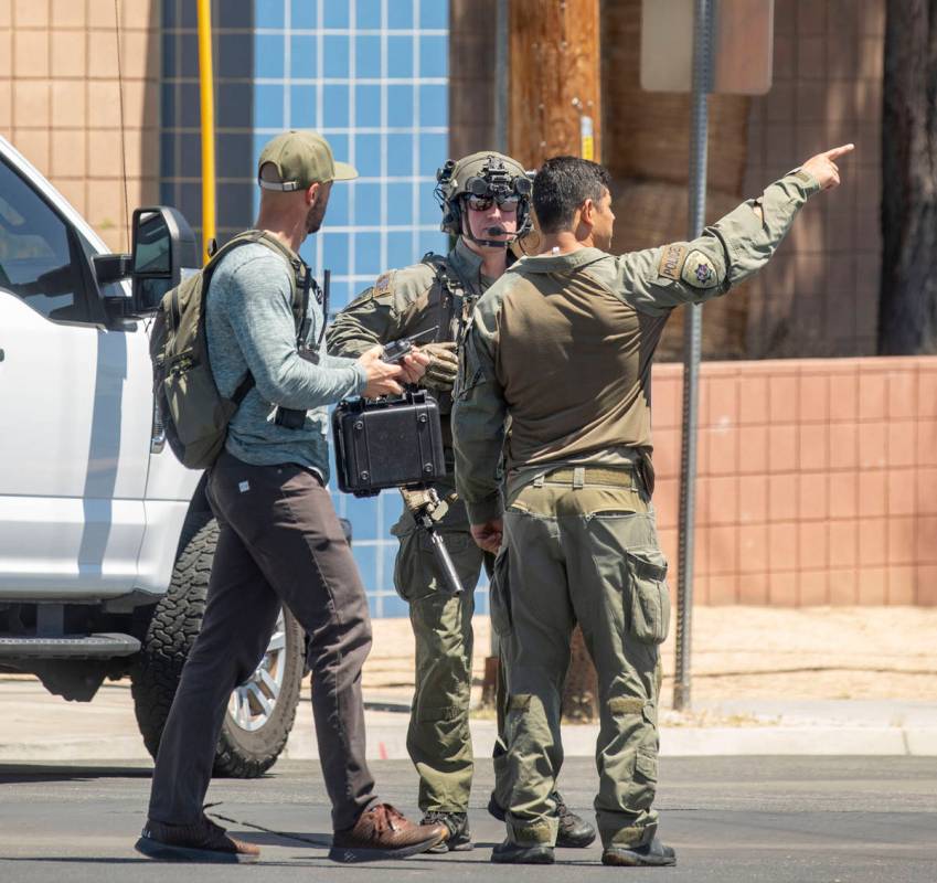 Las Vegas police investigate a downtown shooting in the 1900 block of Fremont Street in Las Veg ...