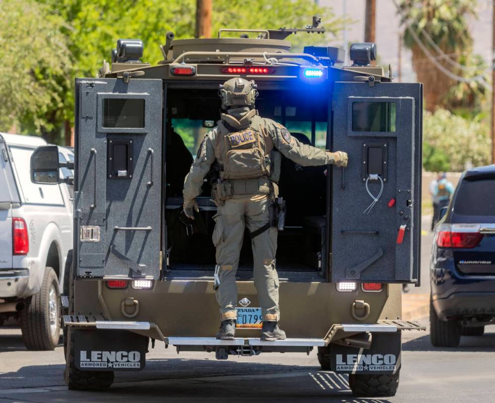 Las Vegas police investigate a downtown shooting in the 1900 block of Fremont Street in Las Veg ...