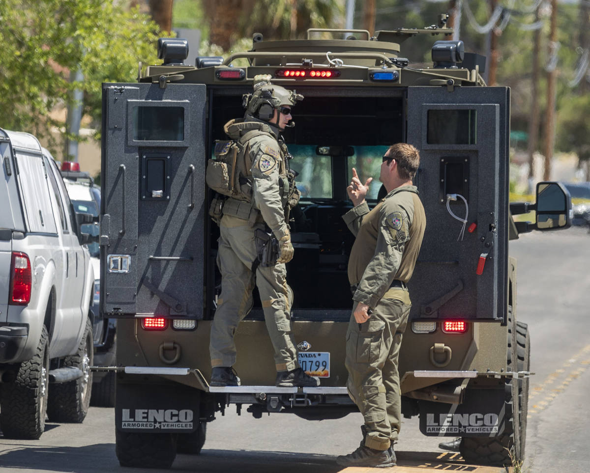 Las Vegas police investigate a downtown shooting in the 1900 block of Fremont Street in Las Veg ...