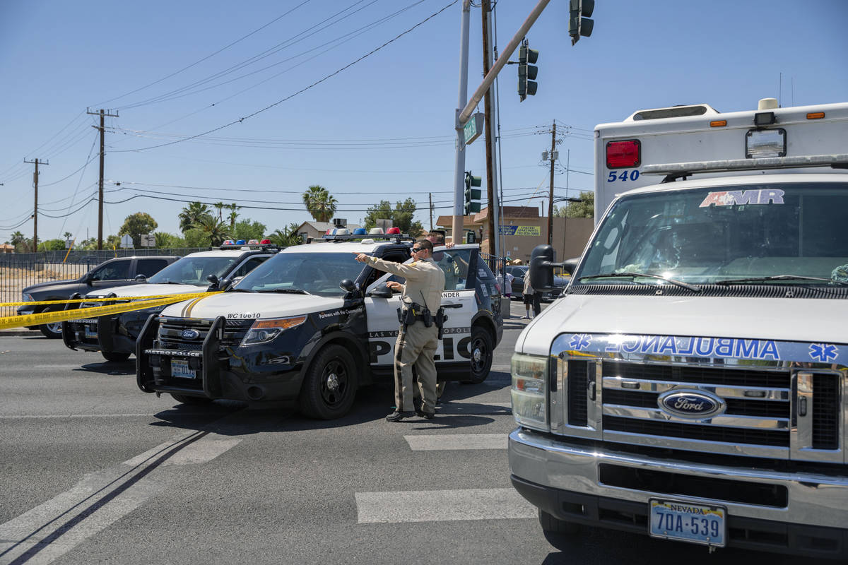 Las Vegas police investigate a downtown shooting in the 1900 block of Fremont Street in Las Veg ...