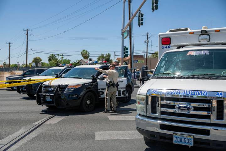 Las Vegas police investigate a downtown shooting in the 1900 block of Fremont Street in Las Veg ...