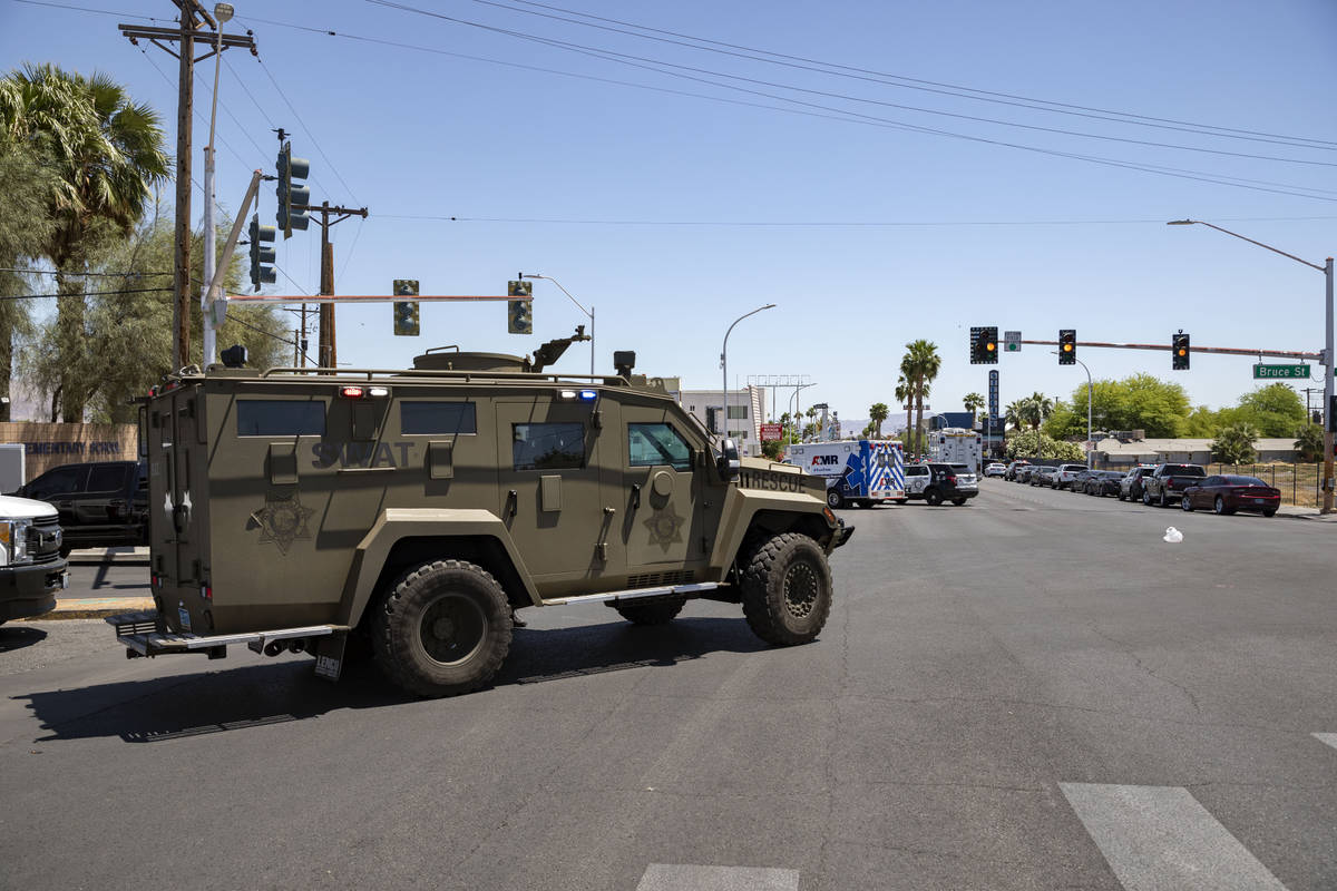 Las Vegas police investigate a downtown shooting in the 1900 block of Fremont Street in Las Veg ...