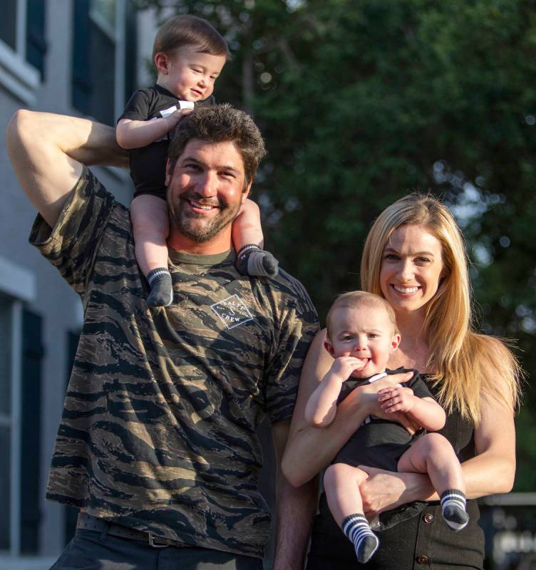 Shannon and David Belford pose for a portrait with their 9-month-old twin sons, Gavin and Garre ...