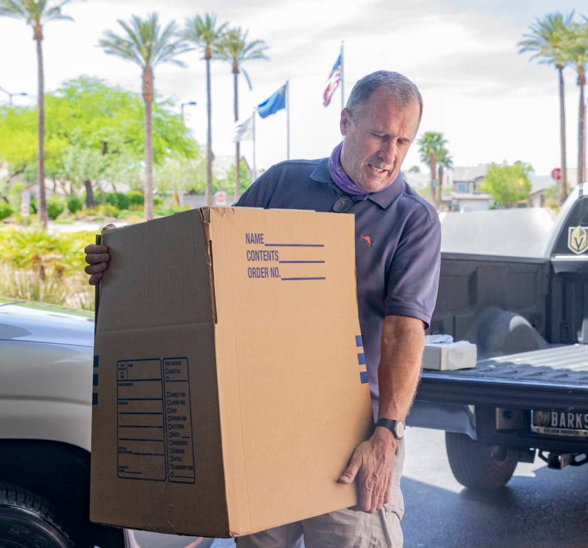 Owner of Jack Russell Terrier Bark-Andre Furry, Rick Williams, carries in donated kits for pedi ...