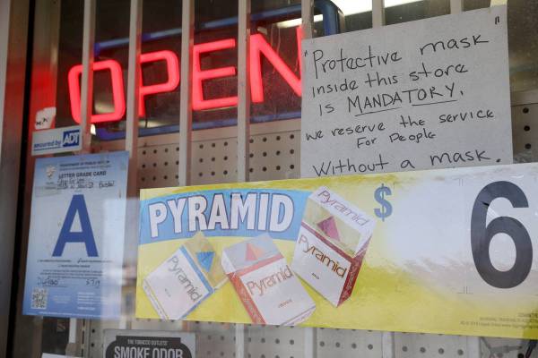 Masks are required at the Shop For Less store on West Main Street in Barstow Calif. Tuesday, Ma ...