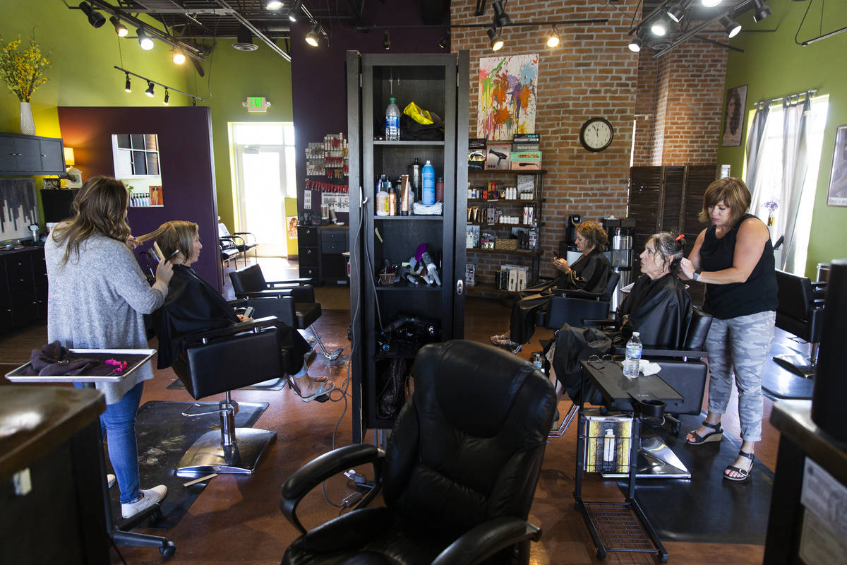 Owner/stylist Brittany Patience, right, cuts Mary Jane Campbell's hair at Salon Khroma on Tuesd ...