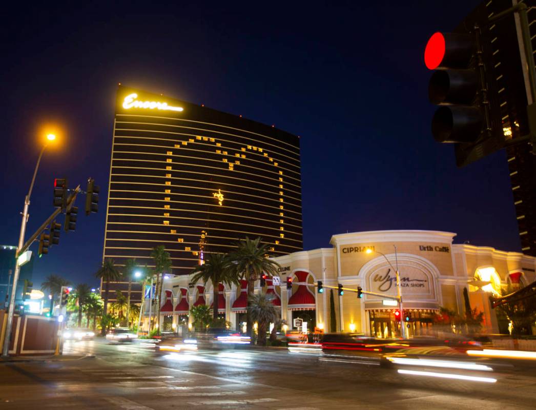 Traffic on the Strip passes by signage on Encore showing support for Las Vegas during the coron ...