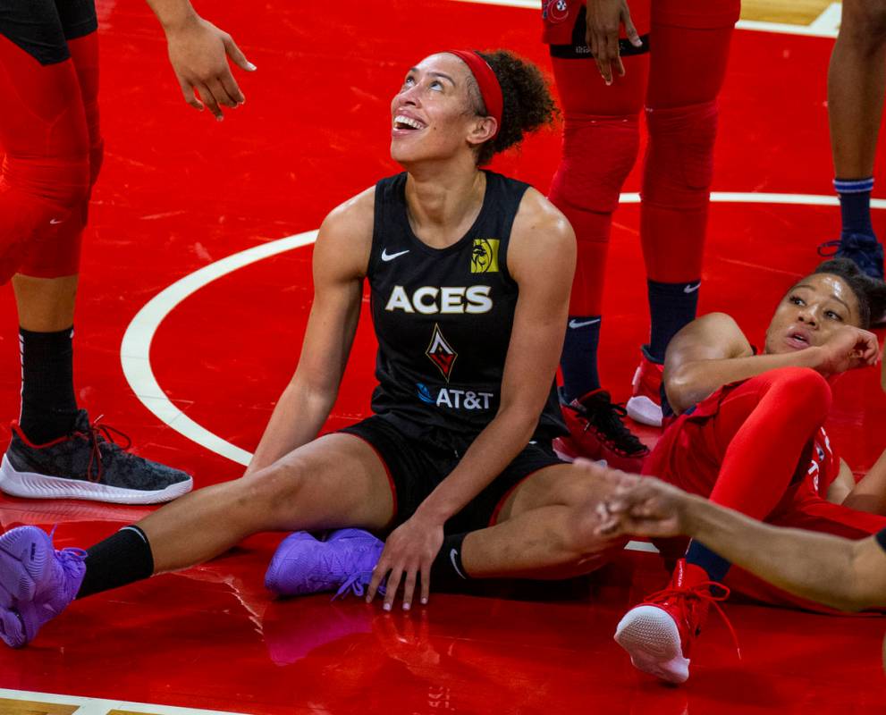Las Vegas Aces forward Dearica Hamby (5, left) laughs during the first half of the WNBA playoff ...
