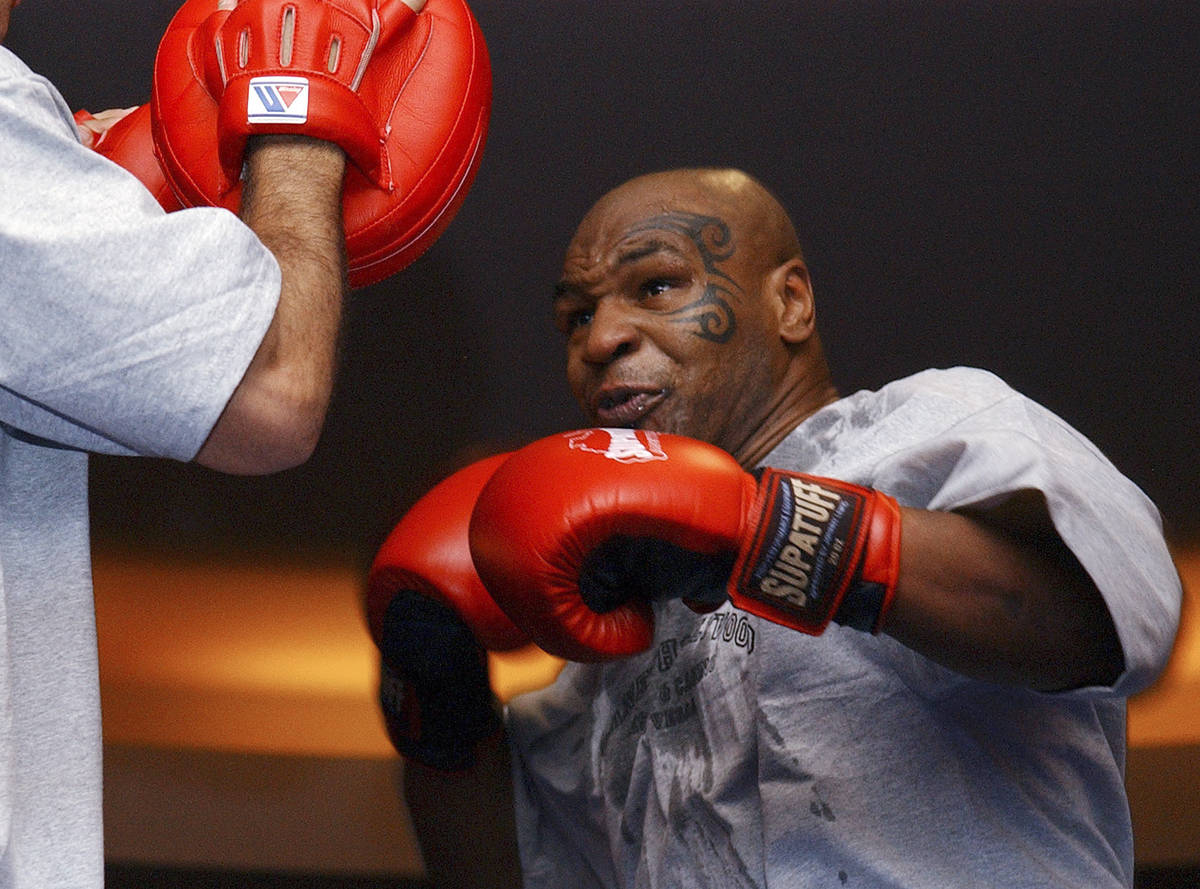 In this Aug. 30, 2006, file photo, former heavyweight boxing champion Mike Tyson spars during a ...