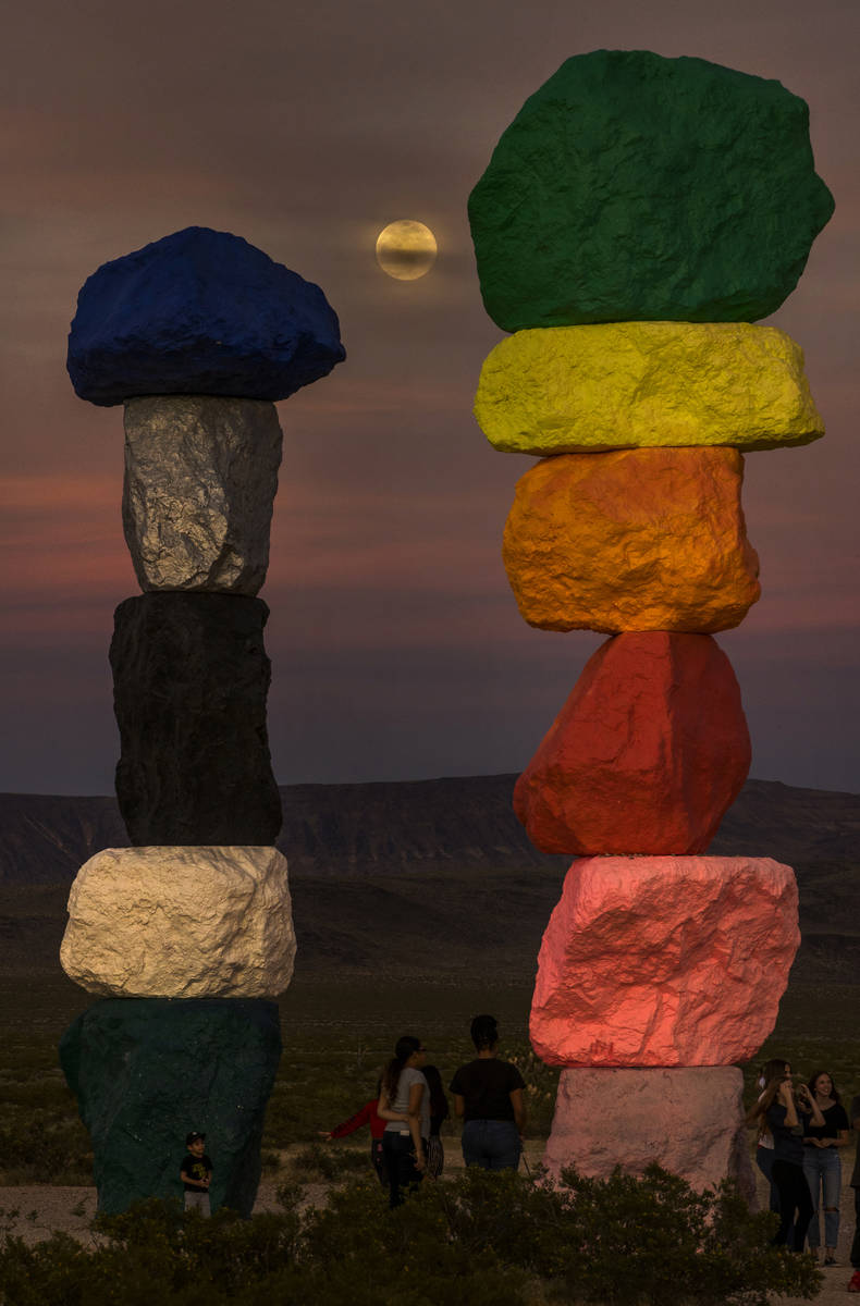 The moon rises over the Seven Magic Mountains outside Las Vegas on May 6, 2020.  The full moon ...