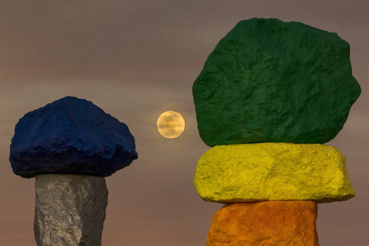The moon rises over the Seven Magic Mountains outside Las Vegas on May 6, 2020.  The full ...