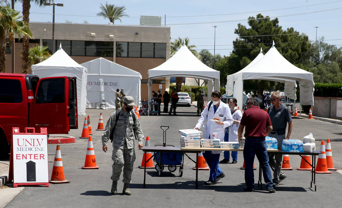 UNLV Medicine staff and Nevada National Guard members doing curbside COVID-19 testing get pizza ...