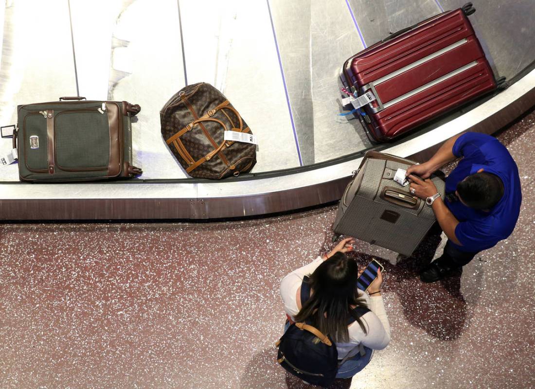 Passengers at Terminal 1 baggage claim at McCarran International Airport in Las Vegas, Wednesda ...