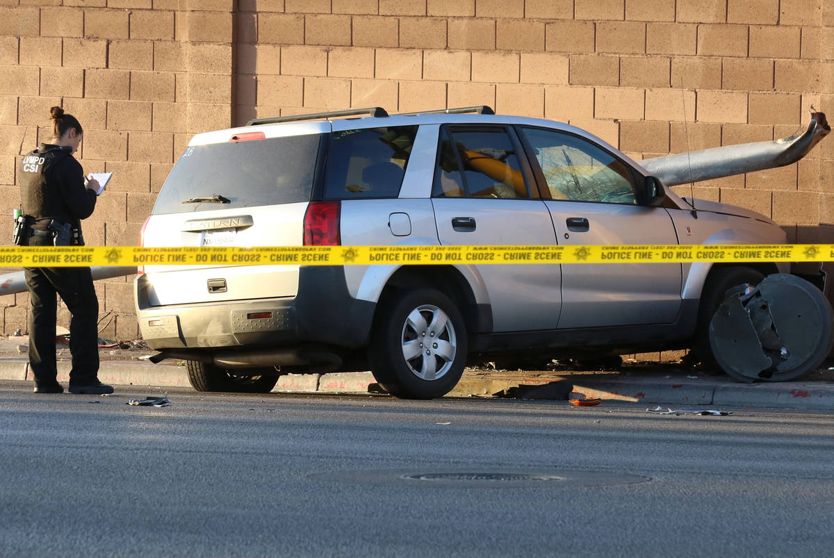 Las Vegas police investigate after a pedestrian was struck by a Saturn Vue SUV near South La Ca ...