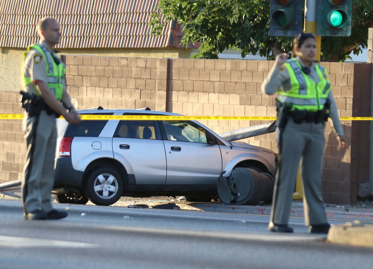 Las Vegas police investigate after a pedestrian was struck by a Saturn Vue SUV near South La Ca ...