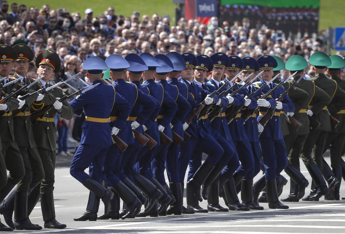 Belarusian soldiers of an honor guard perform during the Victory Day military parade that marke ...