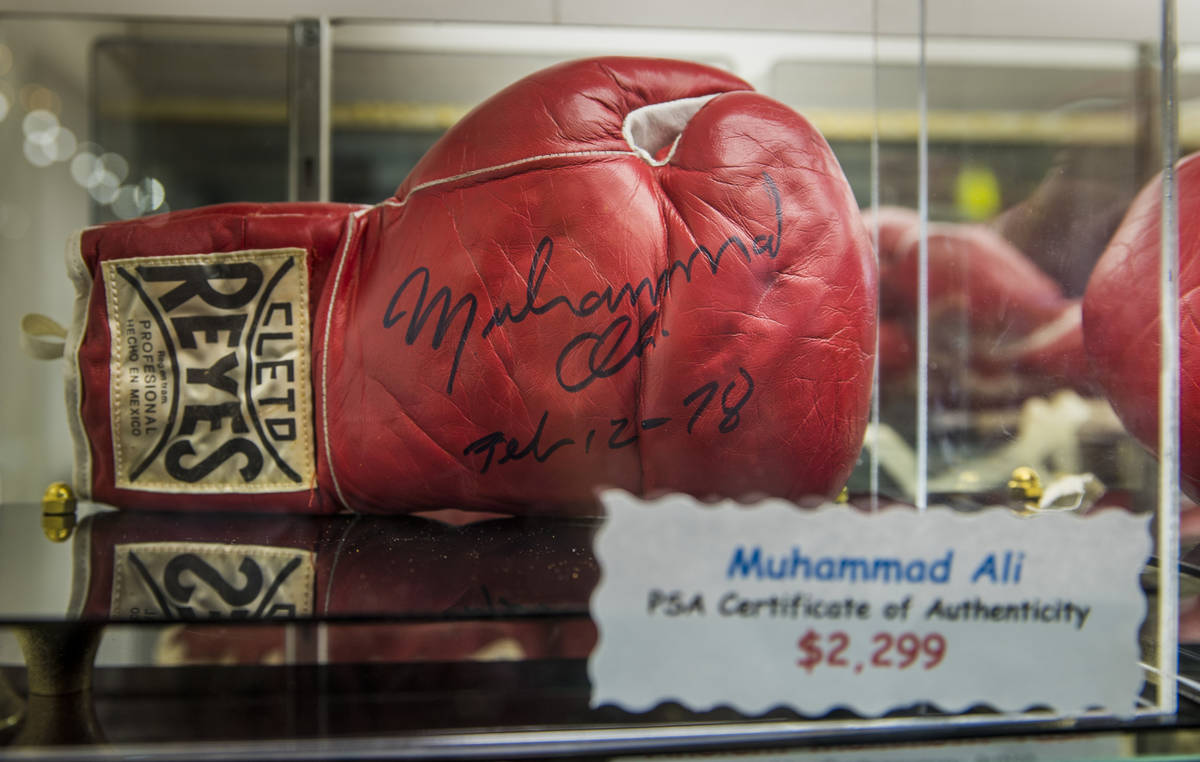 A Muhammad Ali boxing glove is one of the many items for sale within the Antique Alley Mall now ...