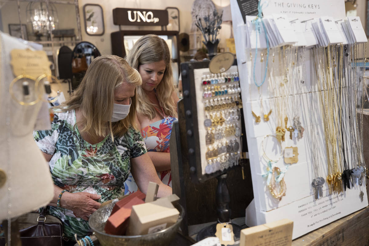 Debbie Foord, left, and her daughter Anna Corcoran shop at Magnolia Lane at The District at Gre ...