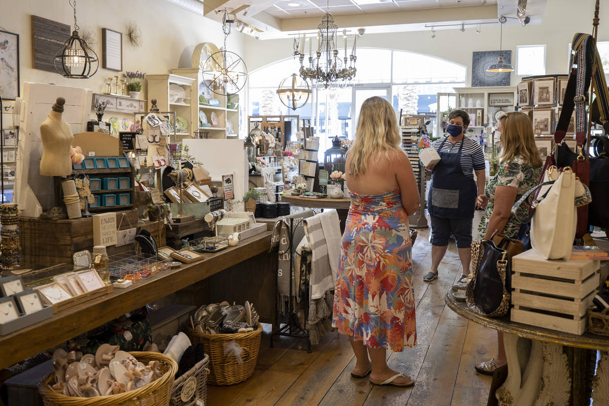 Cathy Pickett, mother of Magnolia Lane's owner Melissa Pickett, speaks with customers in the st ...