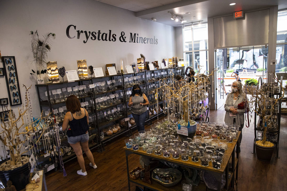 People browse at Silver Post as some businesses reopen at Downtown Summerlin in Las Vegas on Sa ...