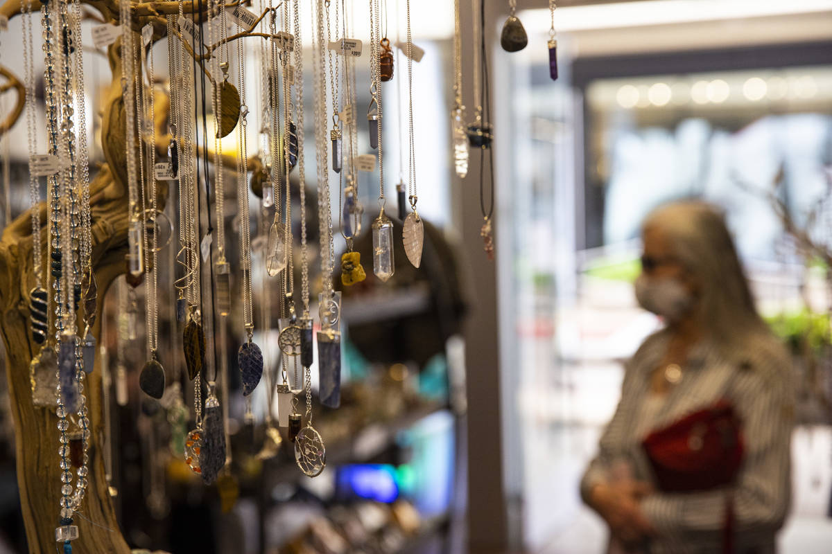 People browse at Silver Post as some businesses reopen at Downtown Summerlin in Las Vegas on Sa ...