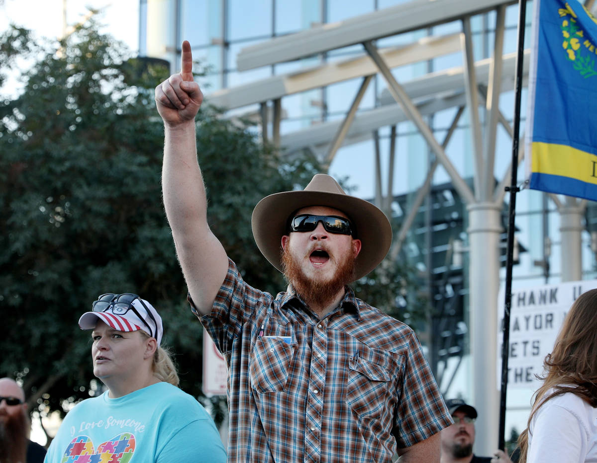 Steven Fernandes, 46, of Las Vegas, cheers during speeches made demanding the city of Las Vegas ...