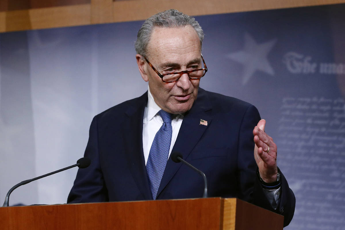 Senate Minority Leader Sen. Chuck Schumer of N.Y., speaks with reporters after the Senate appro ...