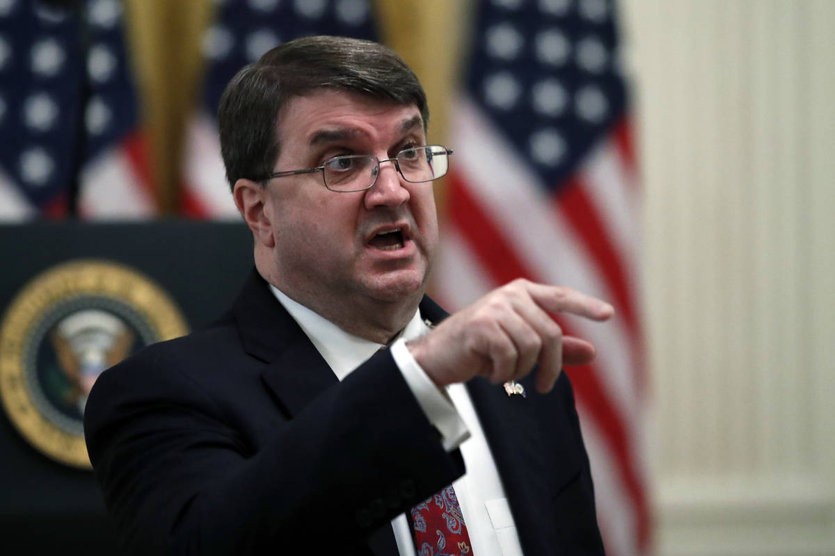 Veterans Affairs Secretary Robert Wilkie talks before President Donald Trump arrives to speak a ...