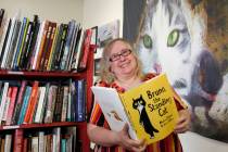 Wendy Marcisofsky, co-owner of Copper Cat Books, shows a book, "Bruno, the Standing Cat,&q ...