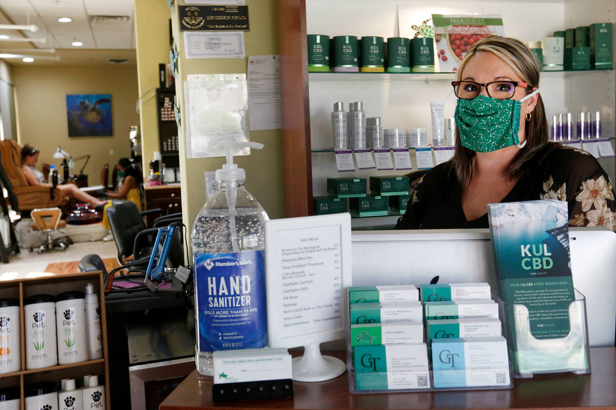 Denise Gustafson, co-owner of Green Turtle Salon and Spa poses for a photo in her shop in Hende ...