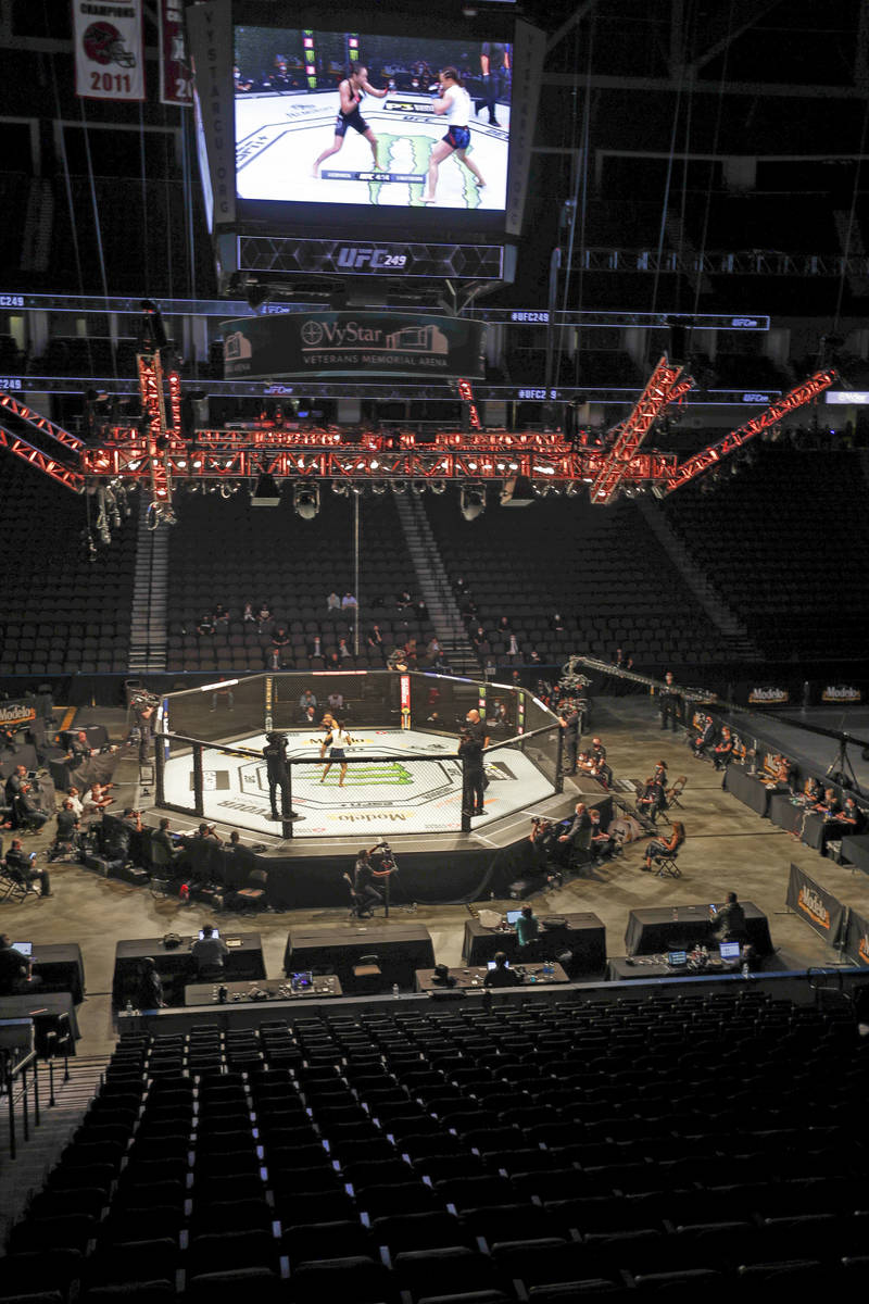 Fighters battle without spectators during a UFC 249 mixed martial arts bout, Saturday, May 9, 2 ...