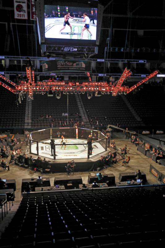 Fighters battle without spectators during a UFC 249 mixed martial arts bout, Saturday, May 9, 2 ...