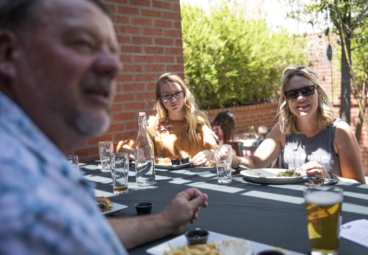 Mike Scronce, far left, has brunch with his wife, Yolanda Scronce, right, and their daughter Tr ...