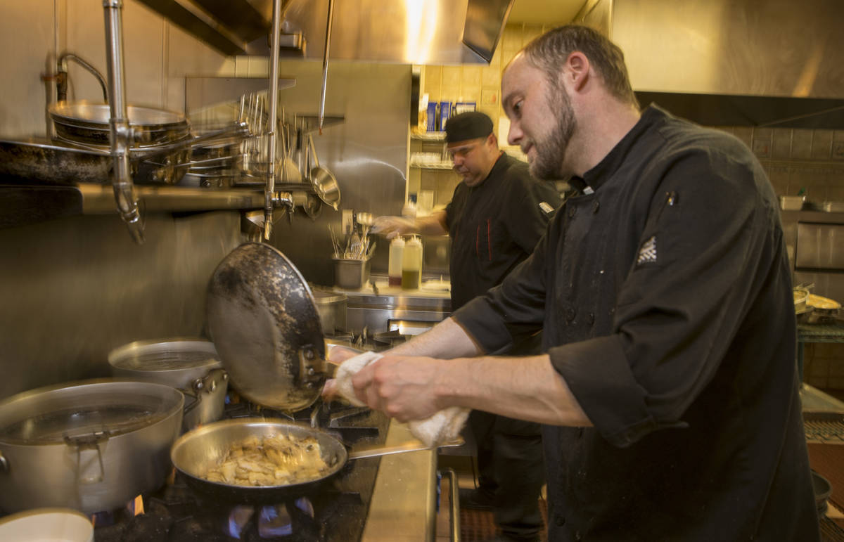 Chef de cuisine Michael Prout, right, prepares another Mother's Day dinners at D'Agostino's Tra ...