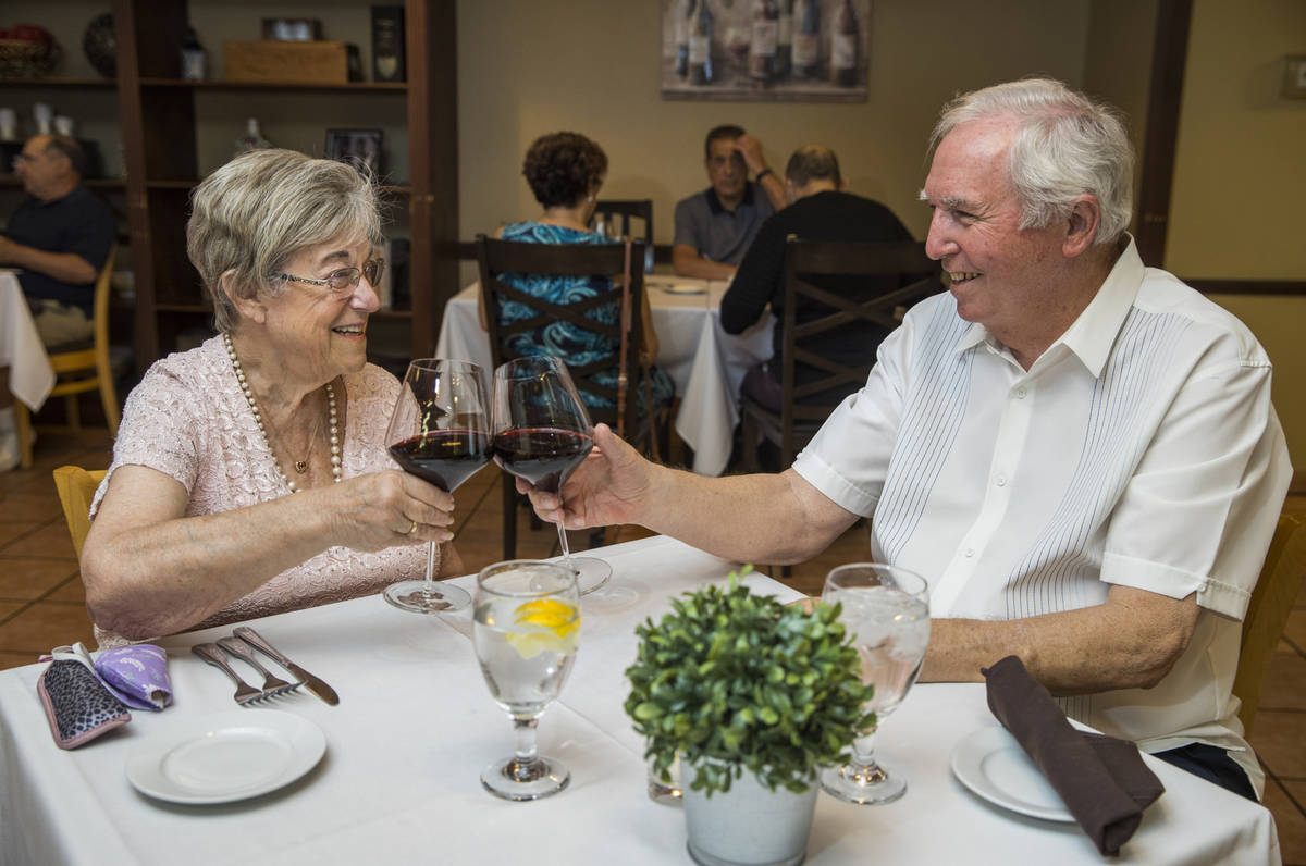 Peggy and Don Thompson share a toast a Mother's Day as they prepare to dine at D'Agostino's Tra ...