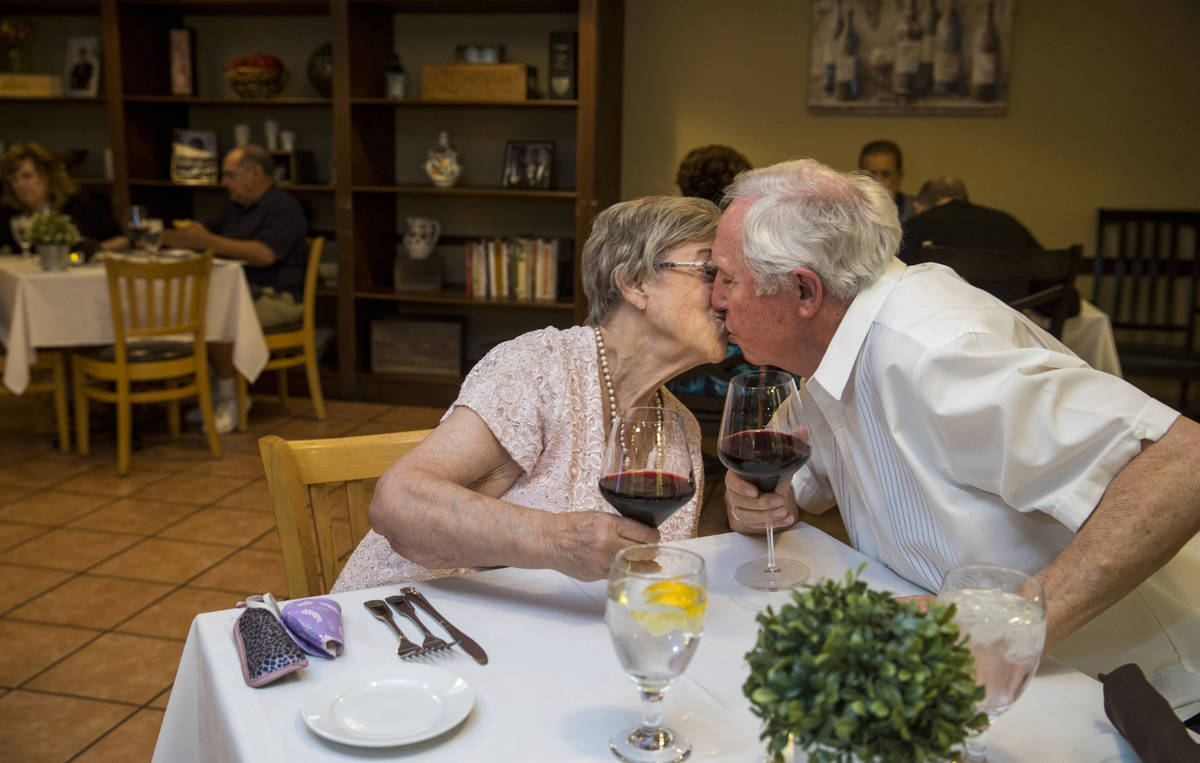 Peggy and Don Thompson share kiss after a toast for Mother's Day as they prepare to dine at D'A ...