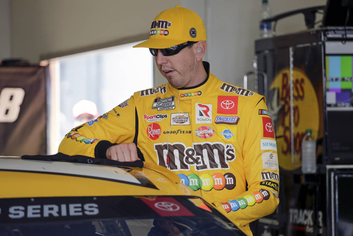 Kyle Busch prepares to get in his car during NASCAR auto race practice at Daytona International ...
